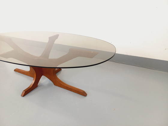 Image 1 of Hugues Poignant Vintage Oval Coffee Table in Teak and Smoked Glass from the 60s and 70s