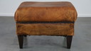 Hocker vintage en cuir de mouton