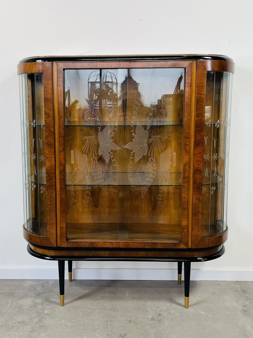 Art deco display case with black elements and glass slats