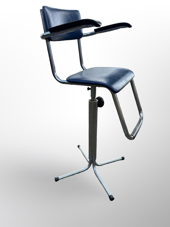 Image 1 of Vintage children's barber chair or high chair with footrest made at Eca the 50s.
