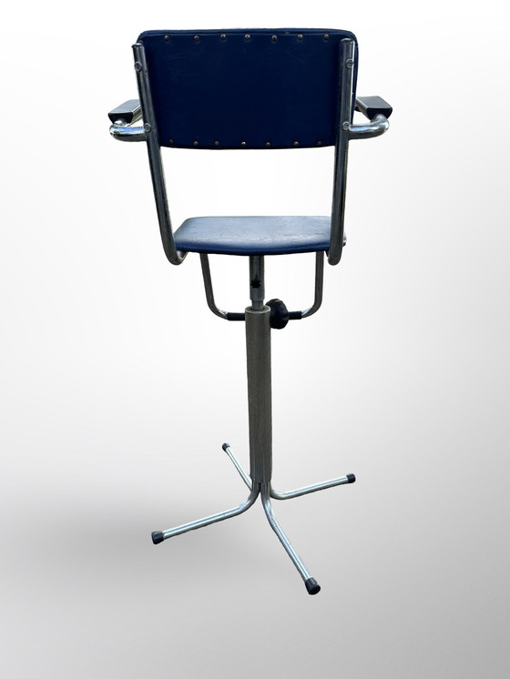 Image 1 of Vintage children's barber chair or high chair with footrest made at Eca the 50s.