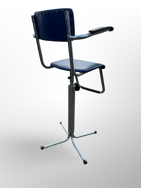 Image 1 of Vintage children's barber chair or high chair with footrest made at Eca the 50s.
