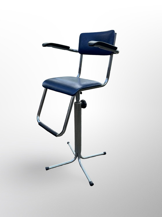 Image 1 of Vintage children's barber chair or high chair with footrest made at Eca the 50s.