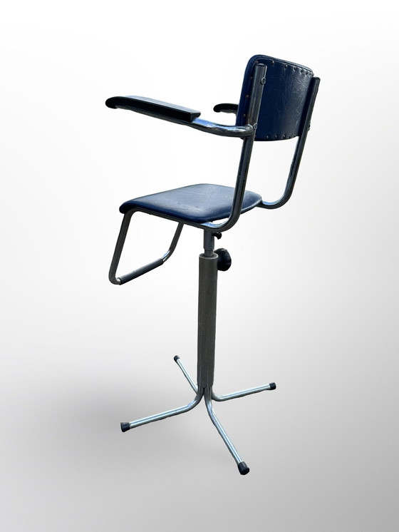 Image 1 of Vintage children's barber chair or high chair with footrest made at Eca the 50s.