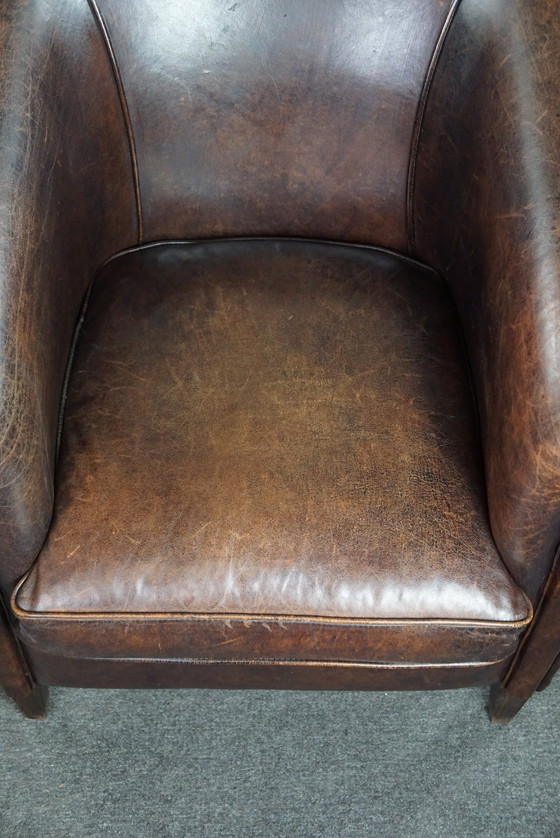 Image 1 of Dark sheep leather club chair, sleek design