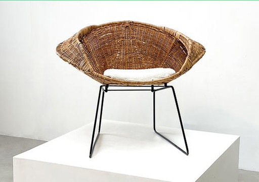 Rattan and bouclé easy chair