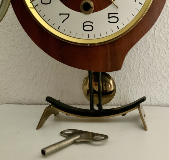 Image 1 of Orfac table clock with pendulum and key