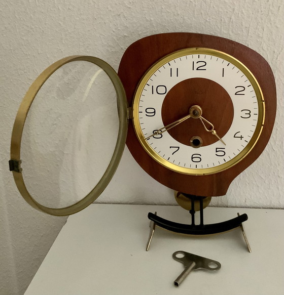 Image 1 of Orfac table clock with pendulum and key