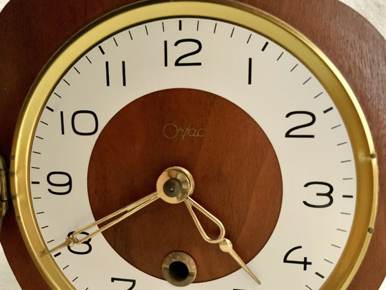 Image 1 of Orfac table clock with pendulum and key