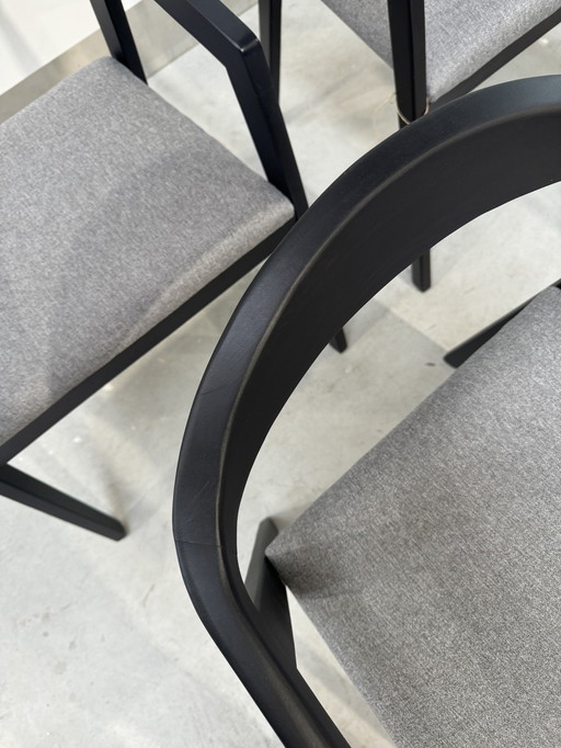 Black wooden dining chairs with gray seat cushion (damaged)