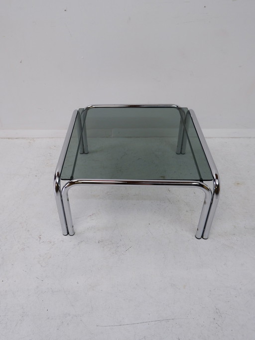 Tube frame coffee table with glass top