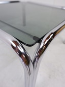 Tube frame coffee table with glass top