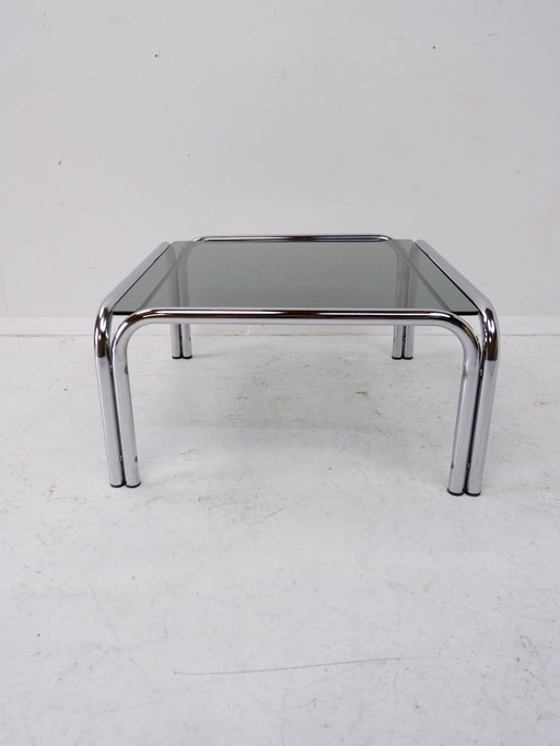 Tube frame coffee table with glass top