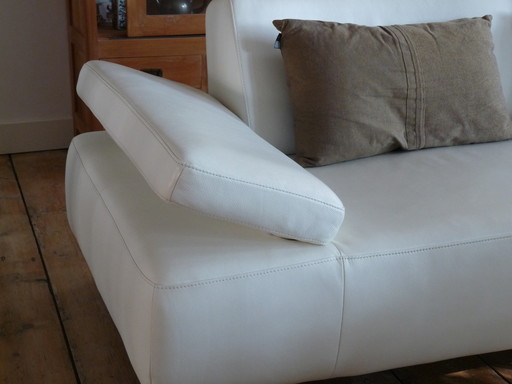 White leather Montèl System corner sofa with various adjustments and with two footstools / footstools