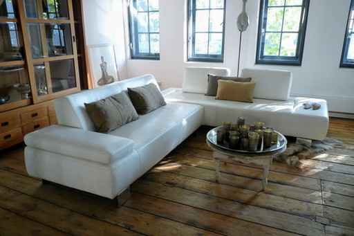 White leather Montèl System corner sofa with various adjustments and with two footstools / footstools