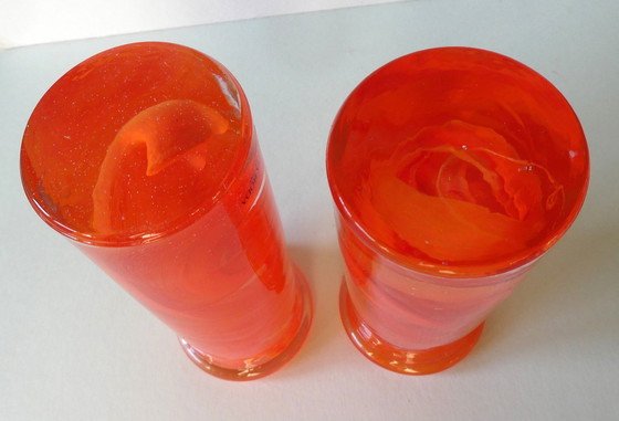 Image 1 of 2 Orange candlesticks Atoll swirl, design Anna Ehrner, Kosta Boda, Sweden