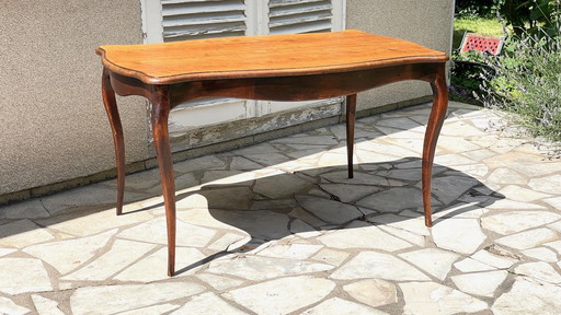 Solid wood table with curved legs France