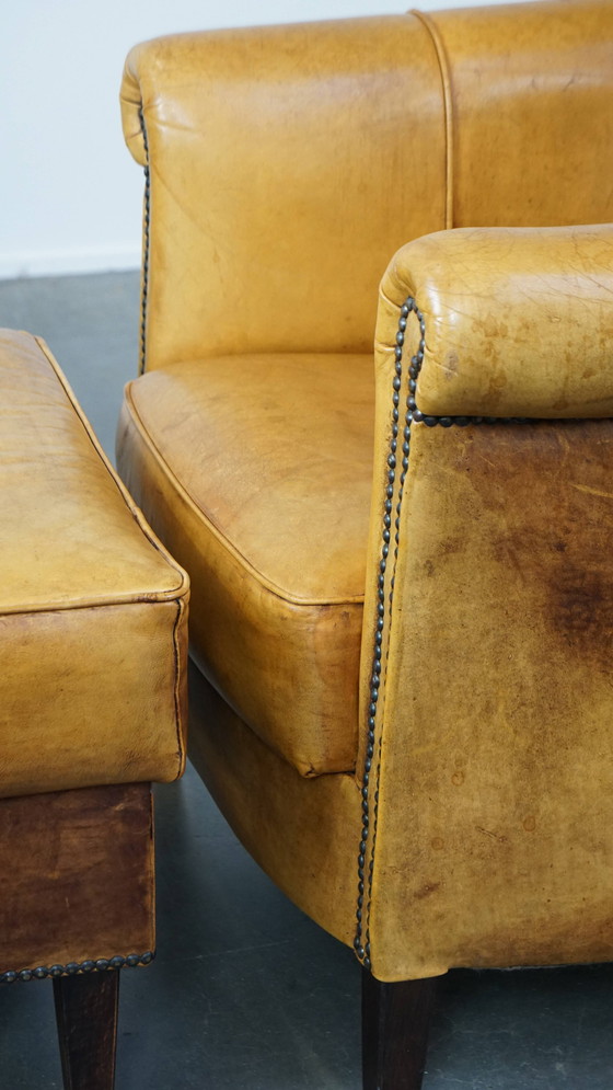 Image 1 of Beef Leather Armchair + Hocker