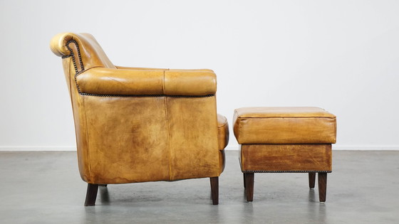 Image 1 of Beef Leather Armchair + Hocker