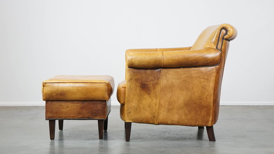 Image 1 of Beef Leather Armchair + Hocker