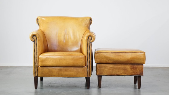 Image 1 of Beef Leather Armchair + Hocker