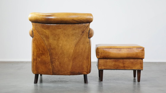 Image 1 of Beef Leather Armchair + Hocker