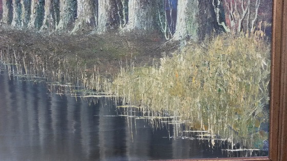 Image 1 of Oil painting with a row of trees on the water signed Verkerk