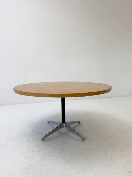 Round Herman Miller dining table with soundproofing