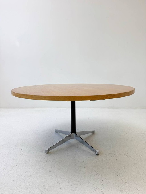 Round Herman Miller dining table with soundproofing