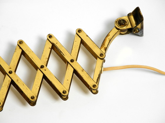 Image 1 of Original Mid Century Brass Extendable Scissor Wall Lamp With Aluminum Diabolo Shade In Red And Brass
