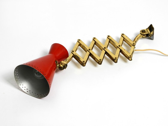 Image 1 of Original Mid Century Brass Extendable Scissor Wall Lamp With Aluminum Diabolo Shade In Red And Brass