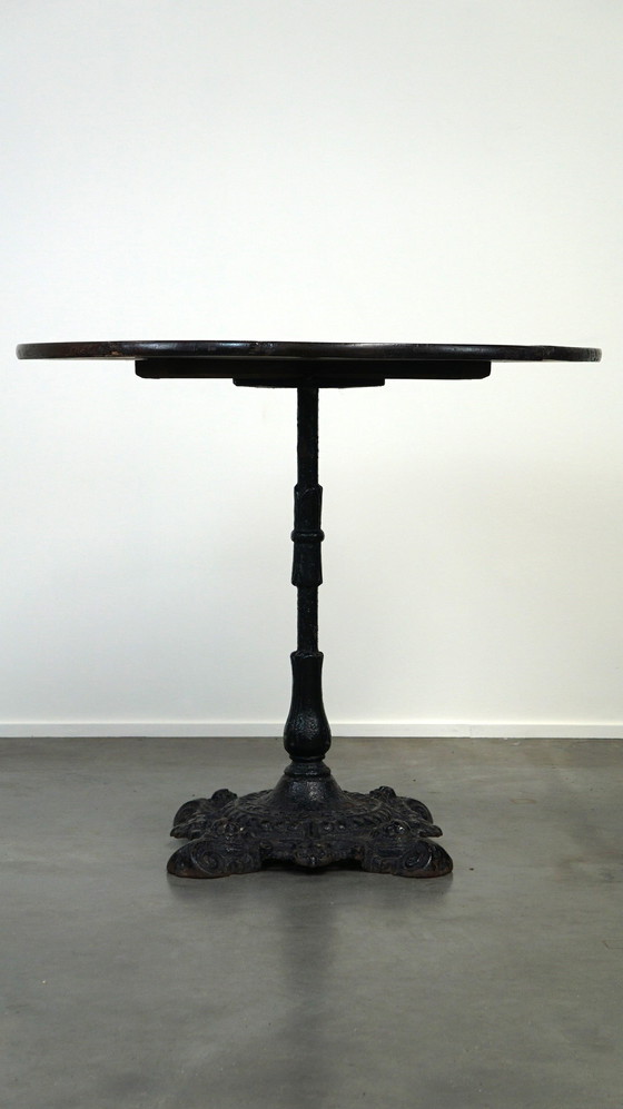 Image 1 of Round English pub table/ side table/ small dining table with cast iron leg and oak top