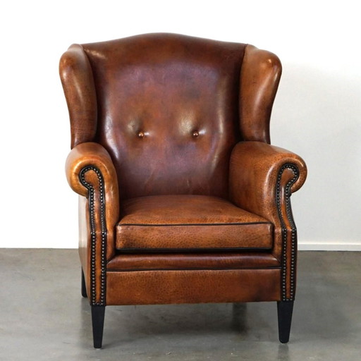 Fauteuil à oreilles en cuir de mouton