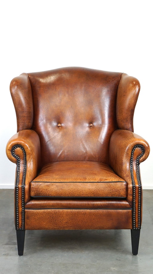 Fauteuil à oreilles en cuir de mouton