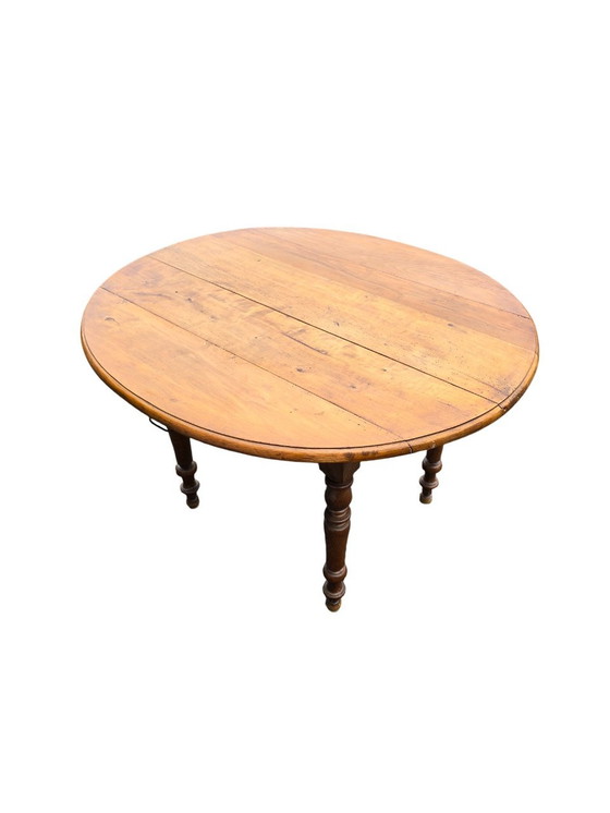 Image 1 of Round Antique Wooden Table with Folding Sides