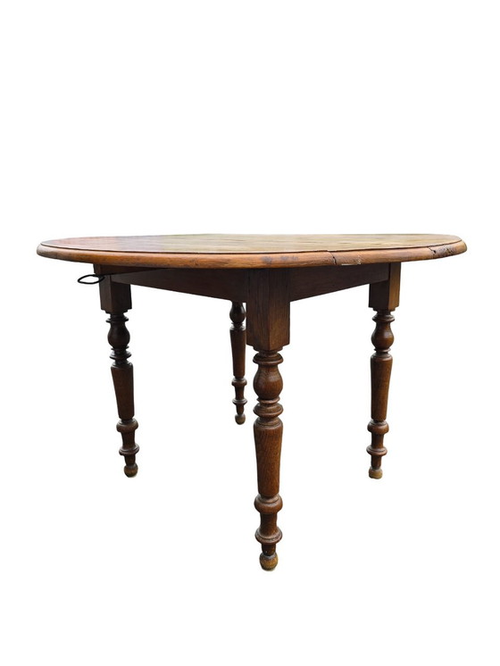 Image 1 of Round Antique Wooden Table with Folding Sides