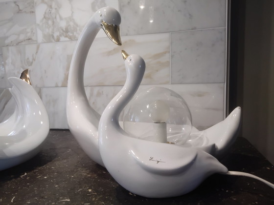 Image 1 of Luigi, 2 × white porcelain swans; 1 lamp and 1 fruit bowl.