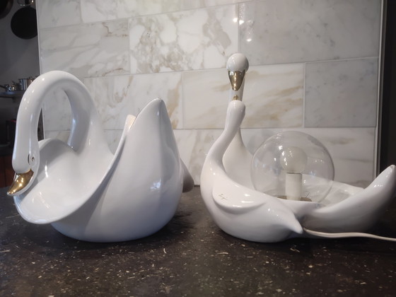 Image 1 of Luigi, 2 × white porcelain swans; 1 lamp and 1 fruit bowl.