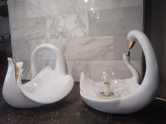 Image 1 of Luigi, 2 × white porcelain swans; 1 lamp and 1 fruit bowl.