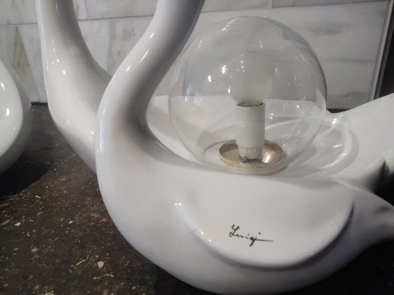 Image 1 of Luigi, 2 × white porcelain swans; 1 lamp and 1 fruit bowl.