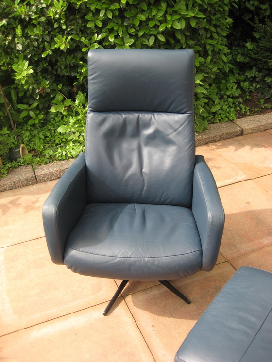 Image 1 of Blue leather swivel armchair with footstool