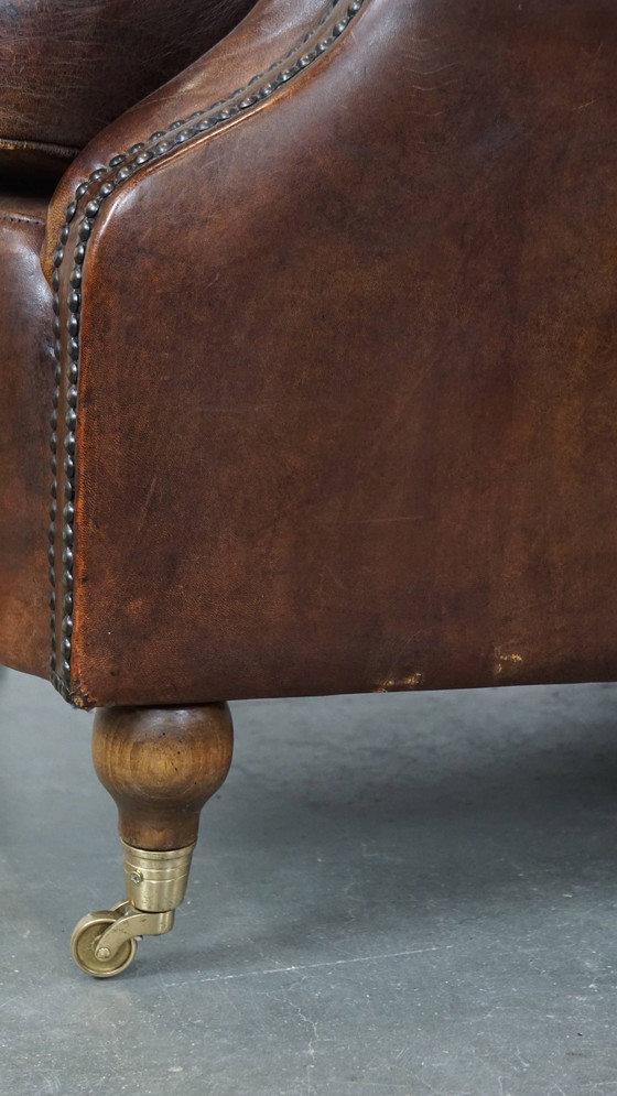 Image 1 of Dark Sheepskin Armchair On Wheels