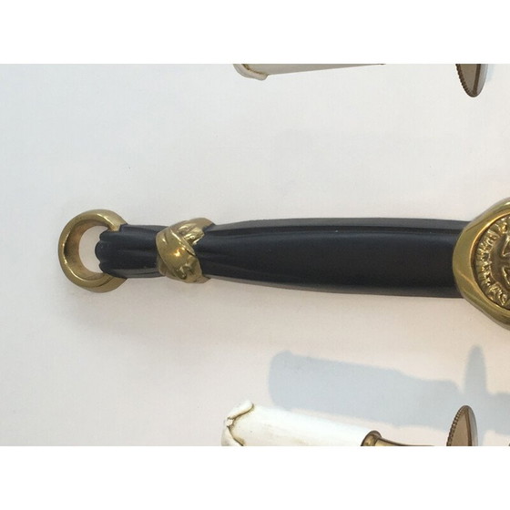 Image 1 of Coppia di applique in bronzo laccato nero con decorazione a testa di leone.