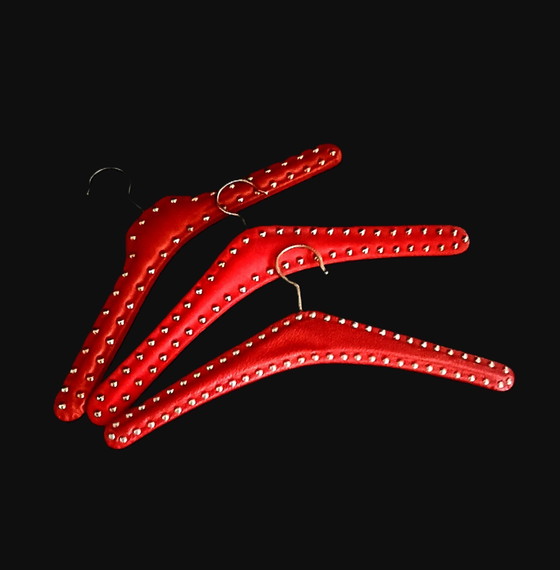 Image 1 of Fifties Red Coat Hangers With Nails