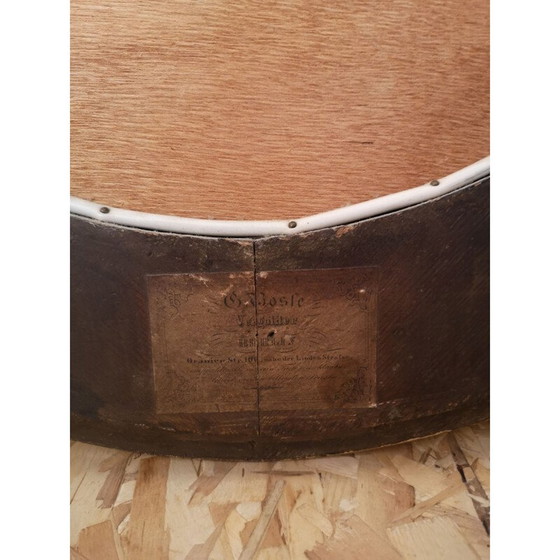 Image 1 of Vintage oval mirror with carved wood and gilded stucco decoration