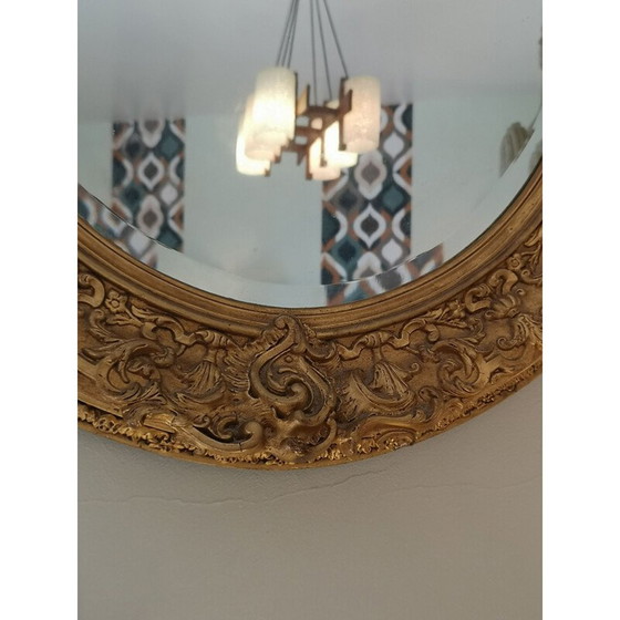 Image 1 of Vintage oval mirror with carved wood and gilded stucco decoration