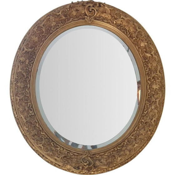 Image 1 of Vintage oval mirror with carved wood and gilded stucco decoration