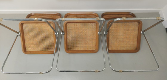 Image 1 of 3x Castelli Plia folding cane chair by Giancarlo Piretti