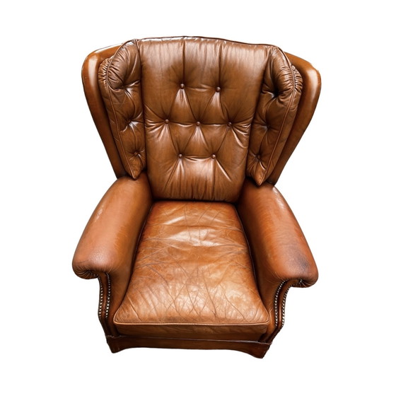 Image 1 of Comfortable armchair made of genuine leather with signs of wear