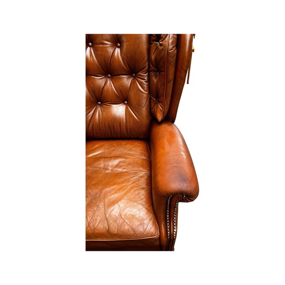 Image 1 of Comfortable armchair made of genuine leather with signs of wear